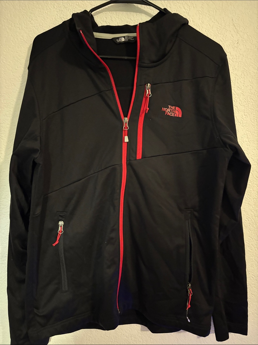 The North Face Black Jacket with Red Trim and Logo